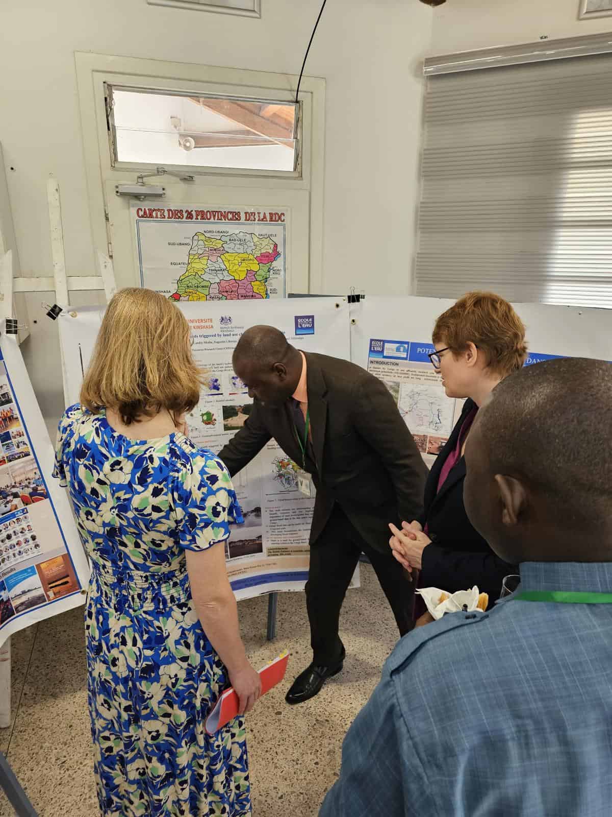 Scientist explaining poster